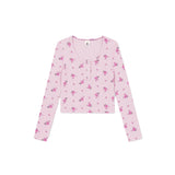 A light pink long-sleeve cropped henley top with a small pink and purple floral pattern, displayed flat against a solid white background.