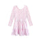A long-sleeve babydoll dress with a tiered skirt, featuring a light pink base with a dense all-over floral print in pink, green, and white.
