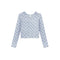A light gray long-sleeve cardigan with a blue floral pattern, featuring a button-up front and a small white brand label at the collar.