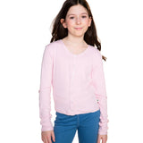 A young girl with long brown hair wearing a light pink long-sleeve button-up cardigan and blue jeans, standing against a solid white background.