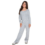 A young girl modeling a grey and blue floral patterned three-piece set, consisting of a cami, long-sleeve top with a button-up front and matching drawstring pants, against a plain white background.