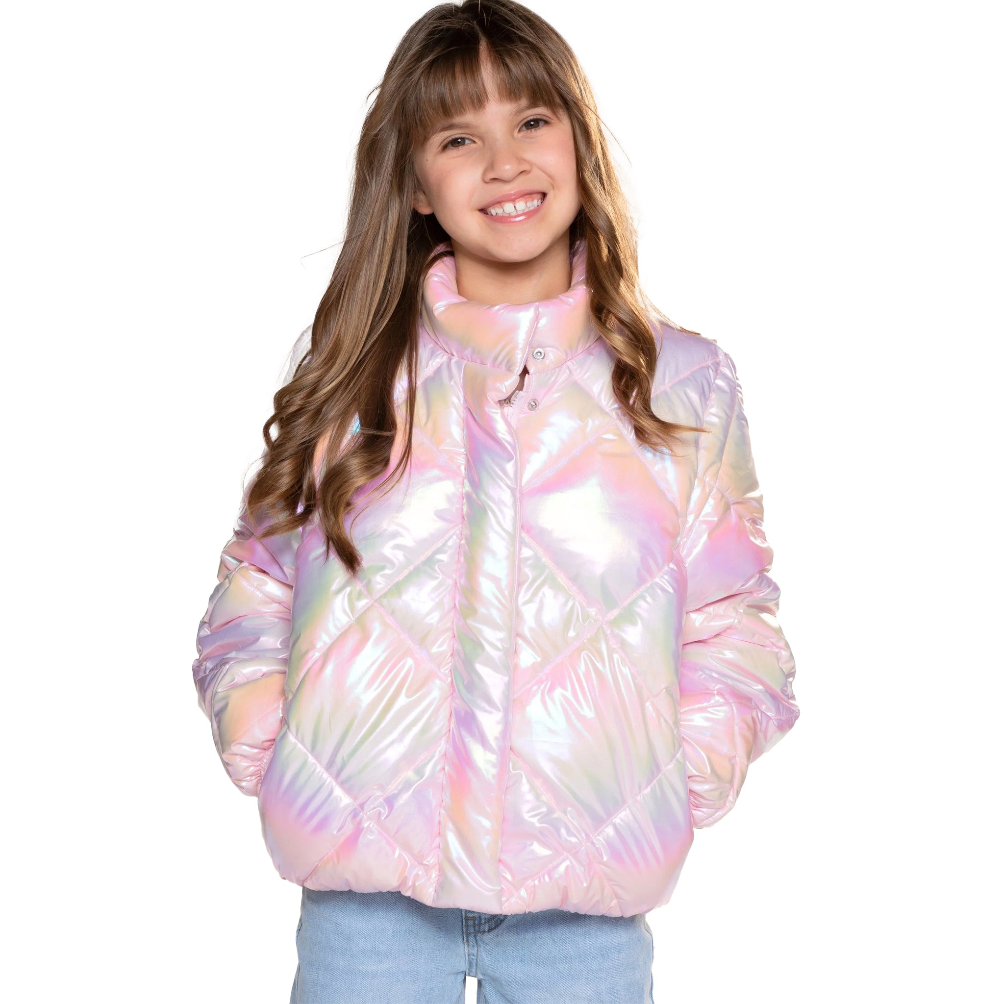 A young girl with long brown hair smiling while wearing a shiny, quilted puffer jacket with an iridescent pastel pink, purple, and blue sheen, paired with light blue jeans, against a solid white background.