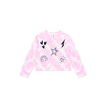 A pink tie-dye long-sleeve crop sweatshirt with black and white graphic prints including hearts, a star, a lightning bolt, a rainbow, and a sun on the front, displayed flat against a white background.