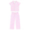 A two-piece girls' pajama set in light pink, featuring a short-sleeve button-front top and matching long pants, both decorated with a small white and light blue floral pattern.