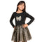 A young girl modeling a black long-sleeve top with a glittery gold bow graphic on the chest, paired with a black and gold glittery tutu skirt, against a plain white background.