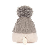 A cable-knit beanie hat in taupe gray with a fluffy gray pom-pom on top and a ribbed cream-colored cuff, shown against a plain white background.