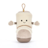 A plush toy shaped like a boot or shoe, made from cream-colored faux fur with a beige corduroy-textured lower section, brown accents on the soles and arm cuffs, and a small tan hanging loop at the top. It has a simple embroidered smiley face.