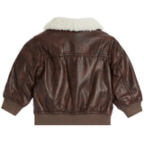 A brown faux-leather bomber jacket with a cream-colored sherpa lining on the collar, shown from the back against a plain white background.