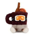 A plush mug character toy with a dark brown fuzzy body, orange ski goggles, a smiling face, and small brown and cream feet, shown on a plain white background.