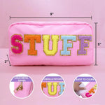 Pink pouch with colorful letters spelling 'STUFF' on a pink background, showing dimensions and features.