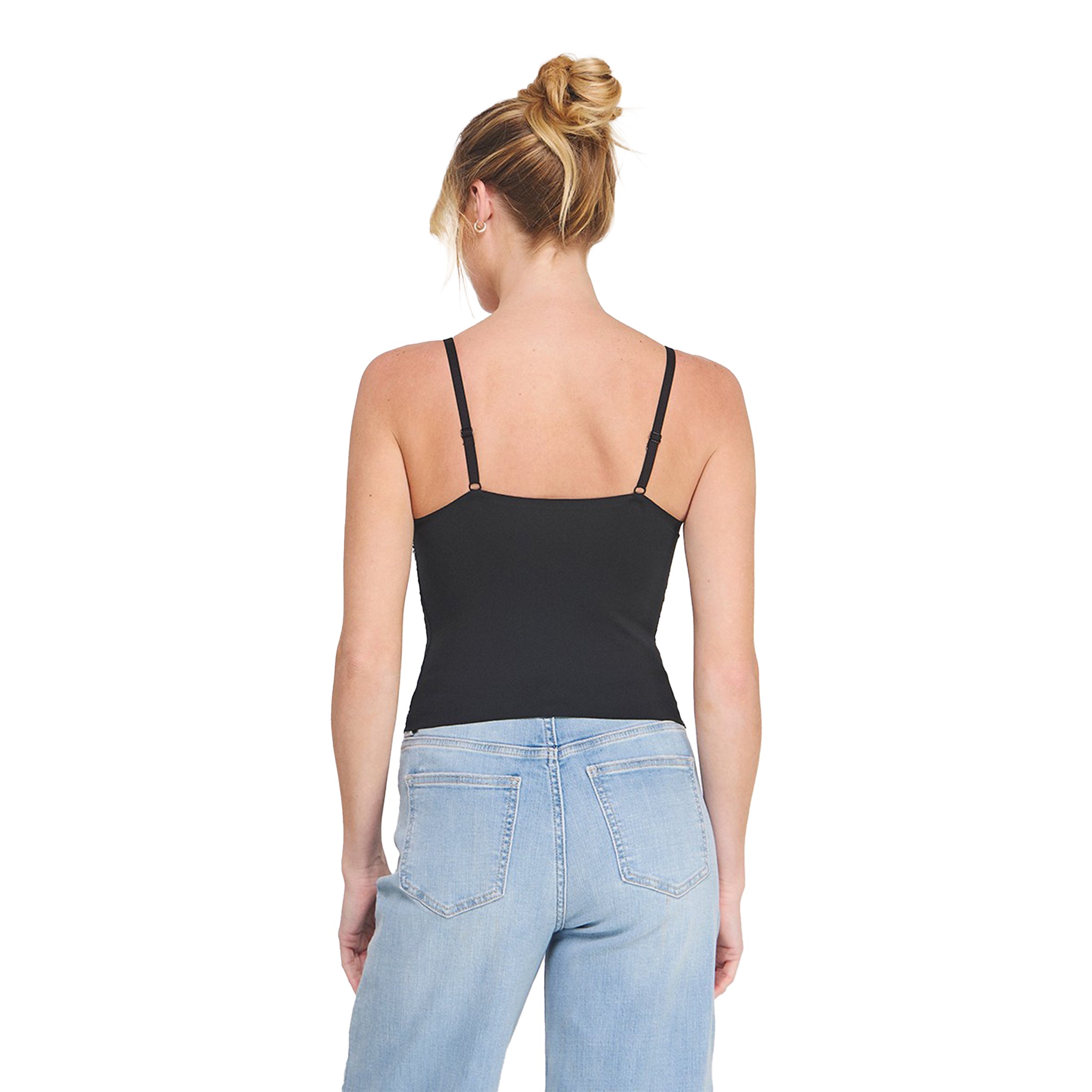 A woman shown from the back wearing a black spaghetti-strap camisole top and light blue jeans against a plain white background.