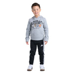 A young boy modeling a gray Adidas hoodie with a cartoon graphic and black Adidas track pants with white stripes, set against a plain white background.