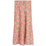 A long skirt with a pink rose and leopard print pattern on a beige background, shown flat against a white background.