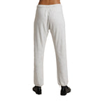 Light heather gray sweatpants shown from the back on a model, paired with black shoes against a plain white background.