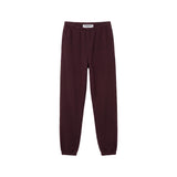 A pair of dark burgundy sweatpants with an elastic waistband and ribbed ankle cuffs, shown flat against a solid white background.
