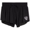 Black double-layered ruffled shorts with an elastic drawstring waist and a white heart pattern on the lower left leg, shown against a plain white background.