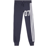 A pair of navy blue sweatpants featuring a white and navy '07' number print on the left thigh and two vertical white stripes on the right leg, shown against a plain white background.