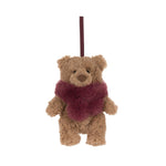 A small plush teddy bear ornament or hanging decoration in light brown with a fuzzy dark red scarf and a matching hanging ribbon at the top, shown on a plain white background.