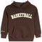 A dark brown pullover hoodie with 'BASKETBALL' printed in cream arched letters across the chest and a small matching print on the left sleeve cuff, shown against a plain white background.