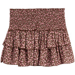 A smocked tiered ruffle mini skirt with a pink and brown floral pattern, shown flat against a white background.