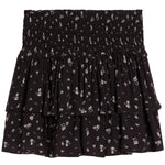 A black tiered ruffle mini skirt with a small white floral print, featuring a smocked elastic waistband.