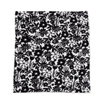 Black floral pattern on a white background