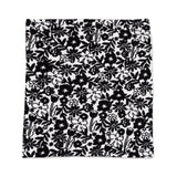 Black floral pattern on a white background