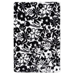 A rectangular black and white floral patterned blanket or throw, shown flat against a white background with one corner folded over.