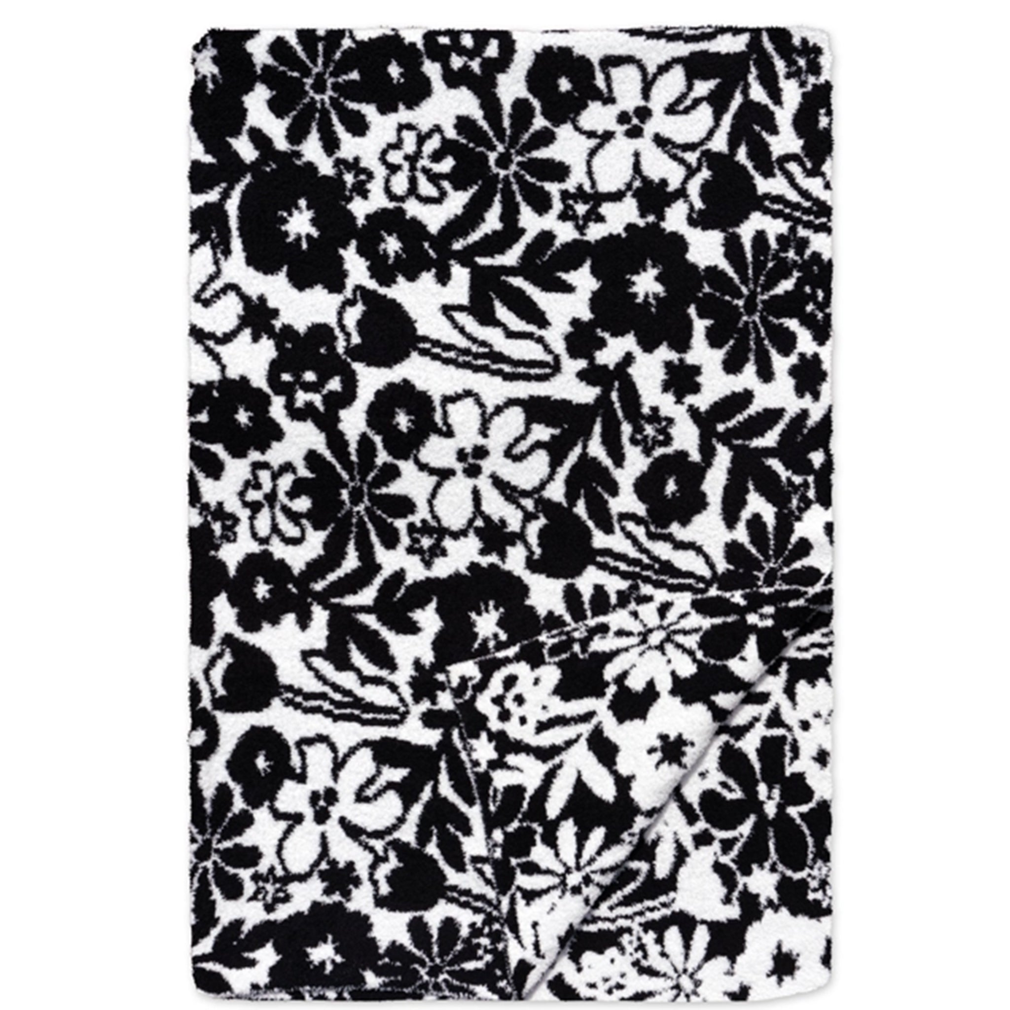 A rectangular black and white floral patterned blanket or throw, shown flat against a white background with one corner folded over.
