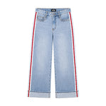 Light wash blue denim cropped jeans with red and white side stripes, shown flat against a white background.