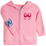 A pink zip-up hoodie for toddlers, featuring a large pink bow graphic on the left chest, a blue polka-dot bow on the right sleeve, and two front pockets with decorative studs.