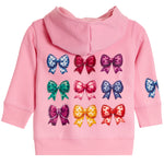 A pink long-sleeve hooded sweatshirt for a child, featuring a graphic print of nine colorful sequined bows on the back and a matching bow design on the sleeve.