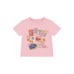 A light pink short-sleeve baby t-shirt with a colorful travel-themed graphic print featuring postage stamps, flowers, and a butterfly on a white background.