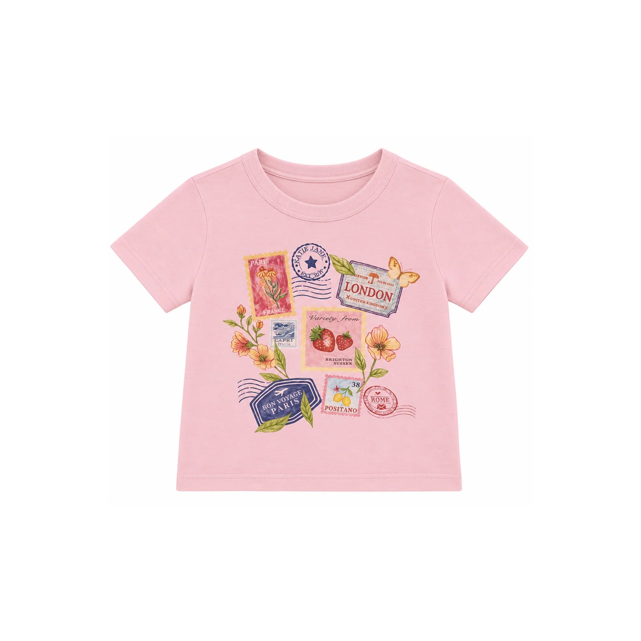 A light pink short-sleeve baby t-shirt with a colorful travel-themed graphic print featuring postage stamps, flowers, and a butterfly on a white background.