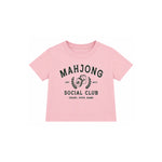 A light pink short-sleeve baby tee with a black graphic print on the front reading 'MAHJONG SOCIAL CLUB' and 'CRAKS, DOTS, BAMS'.