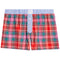 A pair of boxer shorts featuring a vibrant red, pink, and green plaid pattern on the body, a light blue and white striped waistband, and a three-button front closure.