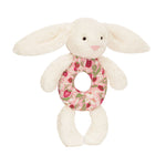 Plush blossom creme bunny berry ring rattle on a white background