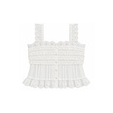 White sleeveless cropped top with intricate lace straps, ruffled trim, and a button-front center, shown on a plain white background.
