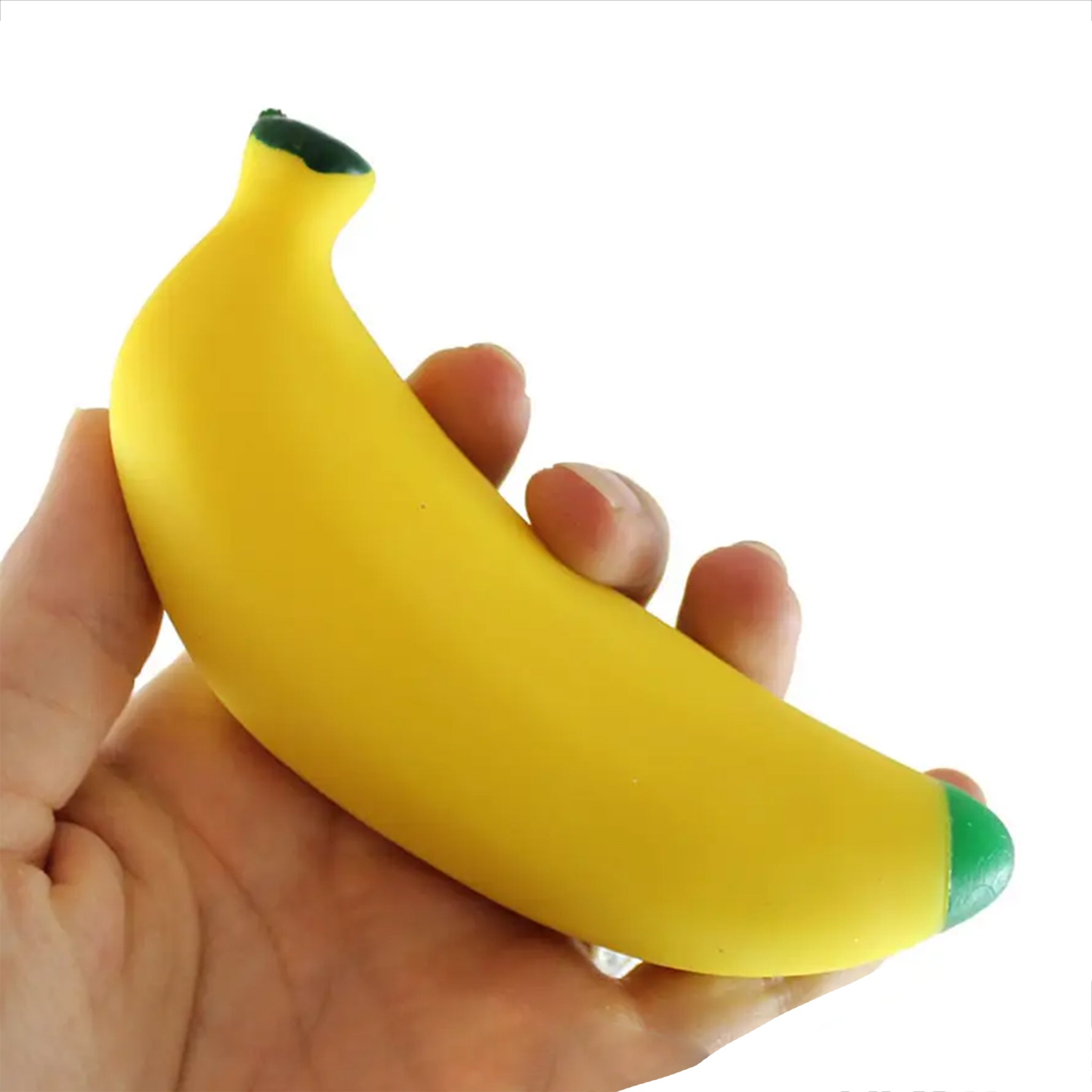Hand holding a banana squishy stress item on a white background