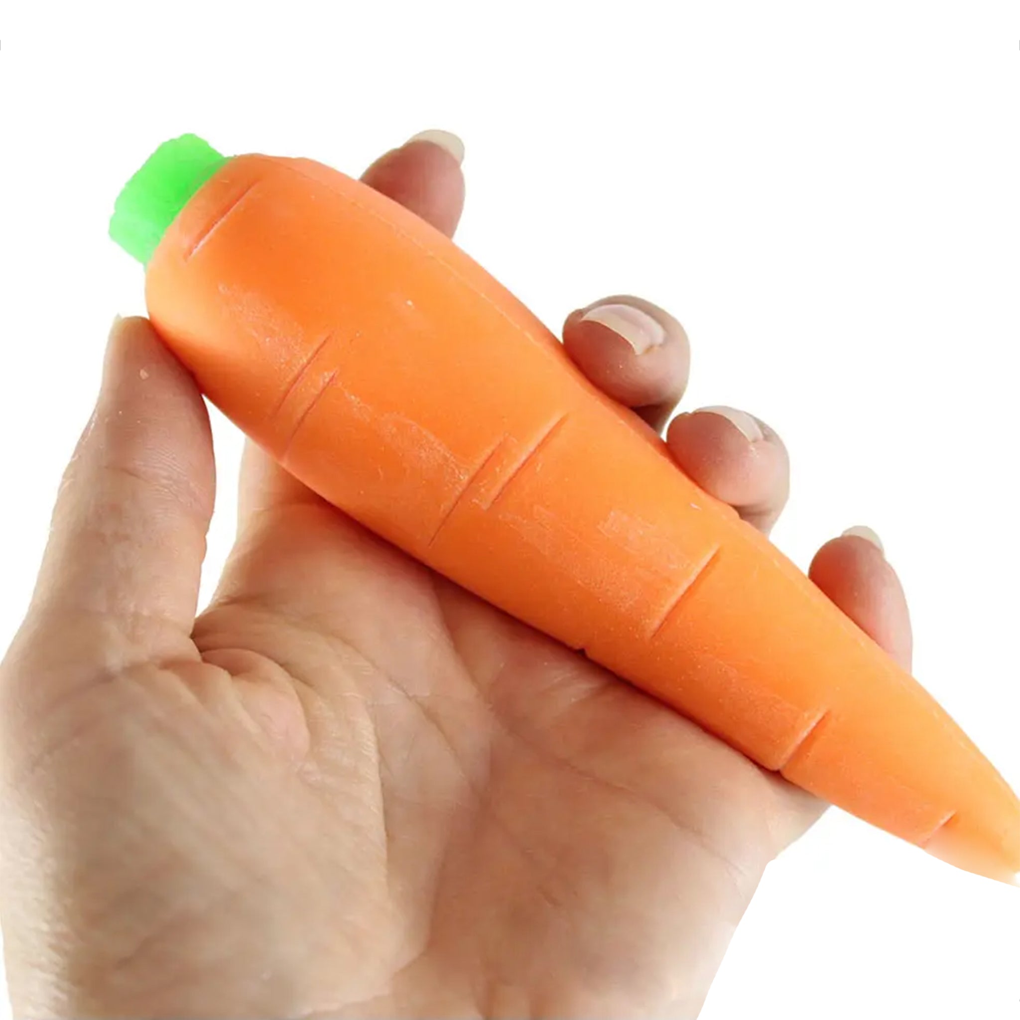 Hand holding a carrot-shaped squishy stress item with a green top on a white background
