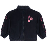 A black sherpa fleece zip-up jacket with pink embroidered lightning bolts on the sleeves and a pink heart-and-smiley patch on the chest, shown on a plain white background.