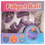 Fidget Ball toy in its original retail packaging, showing purple and white plastic balls inside a clear plastic bag with a pink and blue cardboard header.