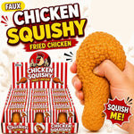 A hand squeezes a textured fried chicken-shaped novelty toy next to a red-and-white striped display box labeled 'Chicken Squishy Fried Chicken.' 