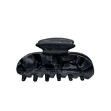 A glossy black hair claw clip shown against a plain white background.