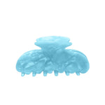 A translucent light blue hair claw clip on a solid white background.