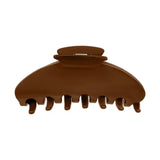 A single brown hair claw clip shown against a plain white background.