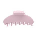 A light pink plastic claw hair clip on a solid white background.