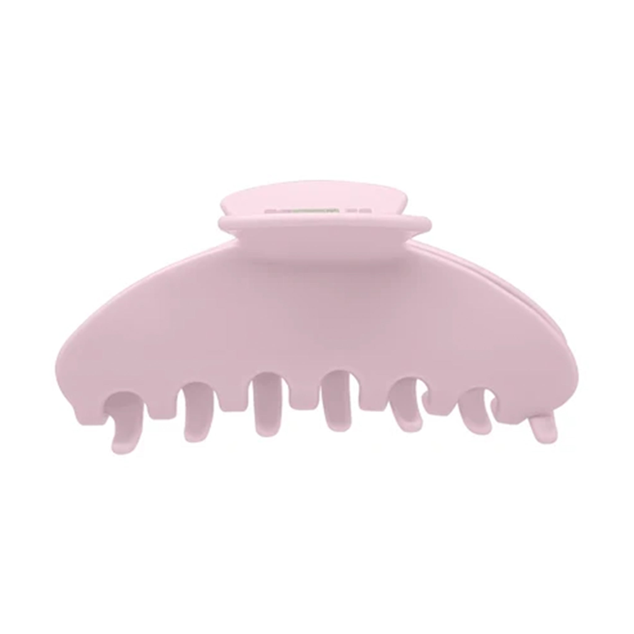 A light pink plastic claw hair clip on a solid white background.