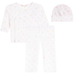 A three-piece baby clothing set including a long-sleeve wrap bodysuit, leggings, and a beanie hat, all in white with a light pink heart pattern, displayed on a solid white background.