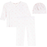 A three-piece baby clothing set including a long-sleeve wrap bodysuit, leggings, and a beanie hat, all in white with a light pink heart pattern, displayed on a solid white background.